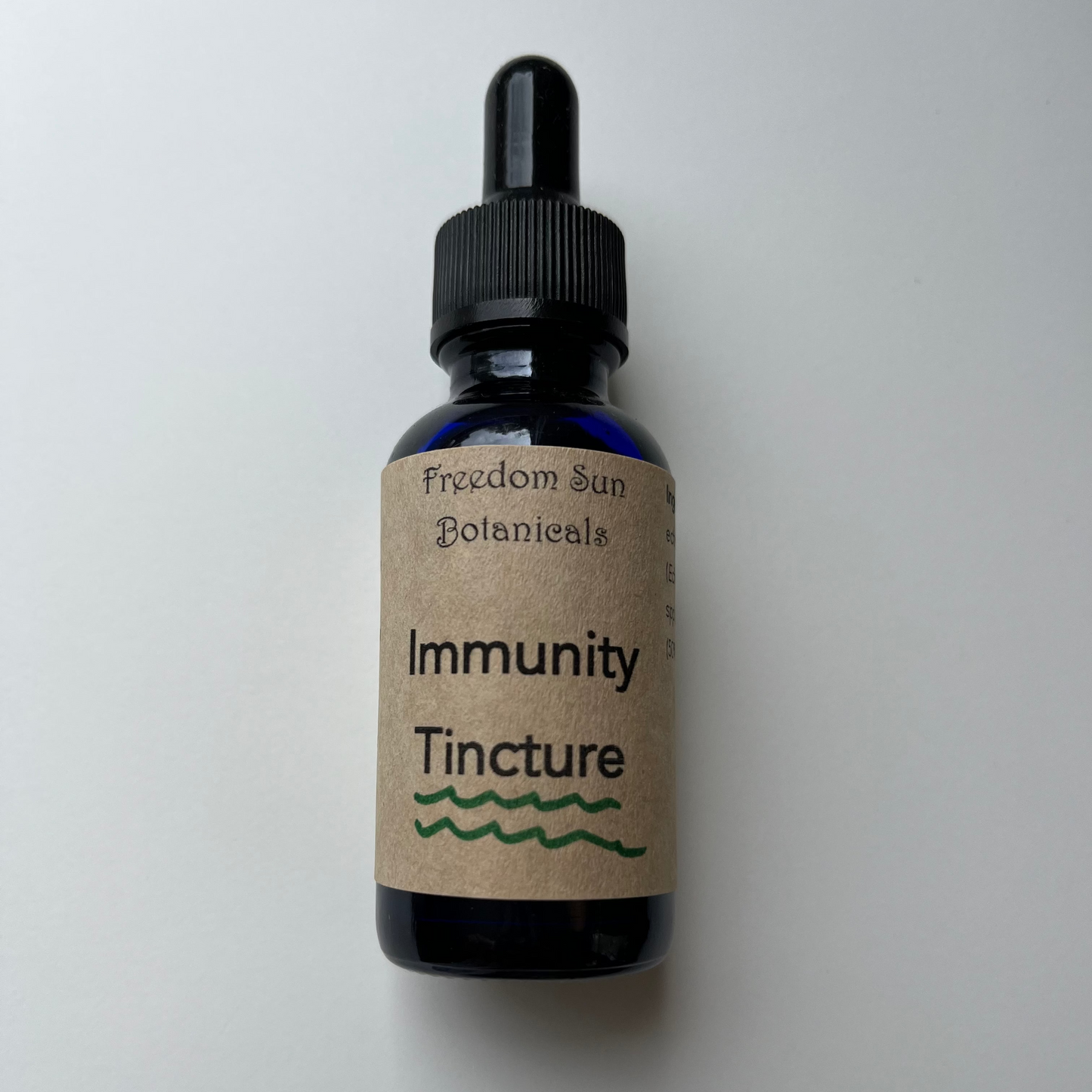 blue bottle on white background with brown immunity tincture label